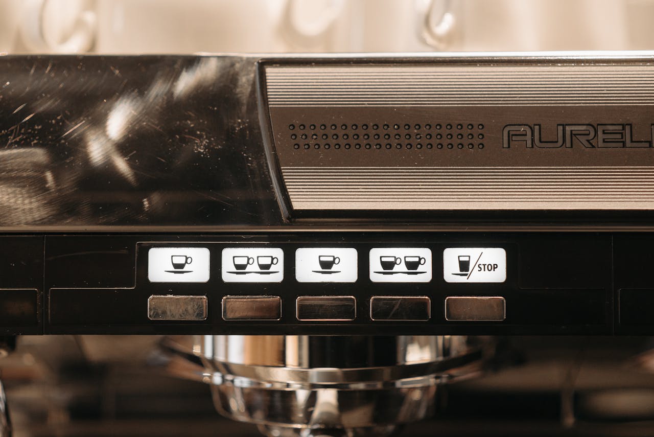 Mastering the First Impression: Your intriguing post title goes here Detailed view of espresso machine control panel with coffee brewing buttons.